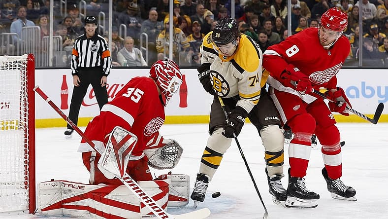 Nov 24, 2023; Boston, Massachusetts, USA; Boston Bruins left wing Jake DeBrusk (74) looks for a rebound in front of Detroit Red Wings goaltender Ville Husso (35) during the first period at TD Garden. Mandatory Credit: Winslow Townson-USA TODAY Sports