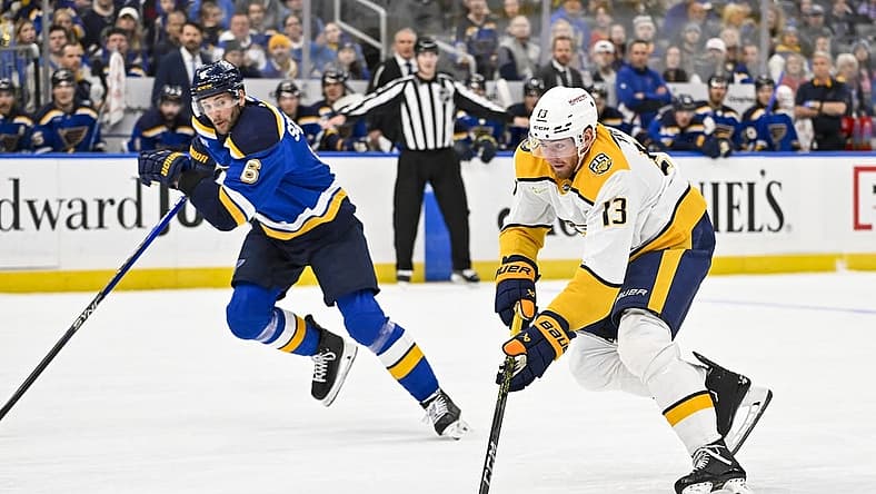 Nov 24, 2023; St. Louis, Missouri, USA; Nashville Predators center Yakov Trenin (13) controls the puck against the St. Louis Blues during the first period at Enterprise Center. Mandatory Credit: Jeff Curry-USA TODAY Sports