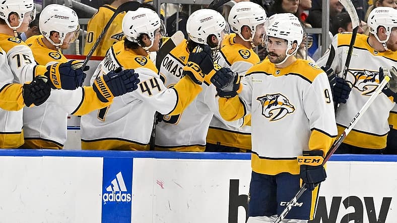 Nov 24, 2023; St. Louis, Missouri, USA; Nashville Predators left wing Filip Forsberg (9) is congratulated by teammates after scoring against the St. Louis Blues during the second period at Enterprise Center. Mandatory Credit: Jeff Curry-USA TODAY Sports