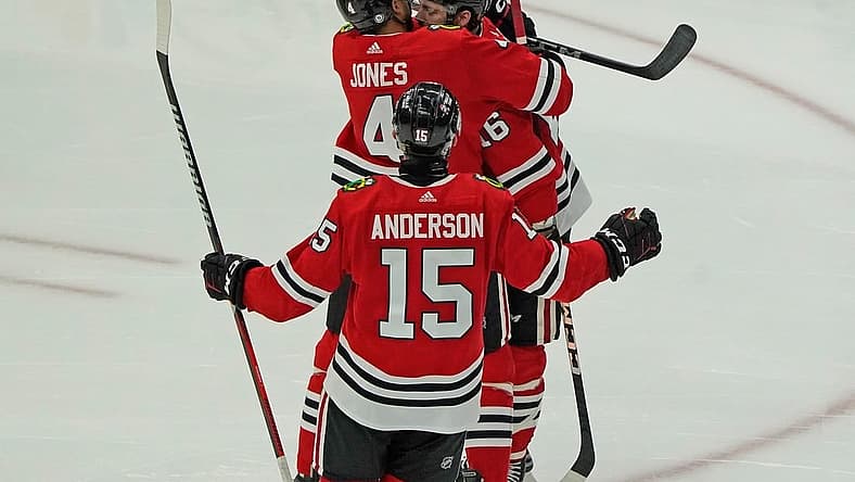 Nov 24, 2023; Chicago, Illinois, USA; Chicago Blackhawks center Jason Dickinson (16) celebrates his hat trick against the Toronto Maple Leafs during the third period at United Center. Mandatory Credit: David Banks-USA TODAY Sports