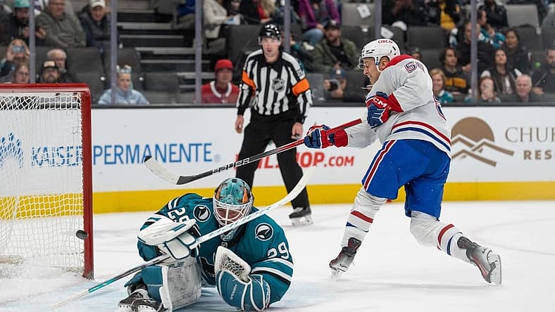 Nov 24, 2023; San Jose, California, USA; Montreal Canadiens right wing Jesse Ylonen (56) shoots the winning goal during the shootout against San Jose Sharks goaltender Mackenzie Blackwood (29) at SAP Center at San Jose. Mandatory Credit: Stan Szeto-USA TODAY Sports