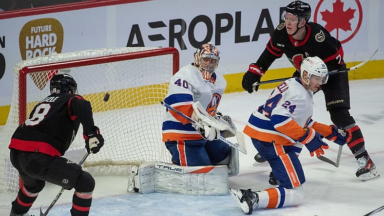 sNov 24 2023; Ottawa, Ontario, CAN; Ottawa Senators center Tim Stutzle (18) and left wing Brady Tkachuk (7) follow the puck as is travels behind New York Islanders goalie Semyon Varlamov (40) in the third period at the Canadian Tire Centre. Mandatory Credit: Marc DesRosiers-USA TODAY Sports