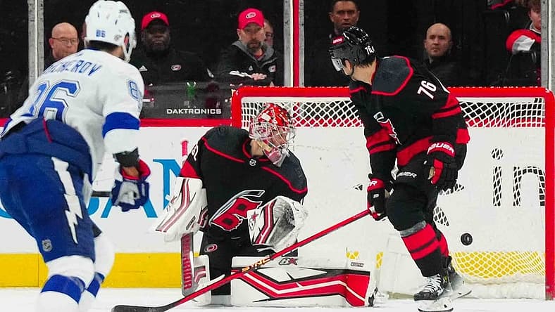 Nov 24, 2023; Raleigh, North Carolina, USA; Carolina Hurricanes goaltender Antti Raanta (32) watches Tampa Bay Lightning center Brayden Point (21) (not shown) goal during the third period at PNC Arena. Mandatory Credit: James Guillory-USA TODAY Sports