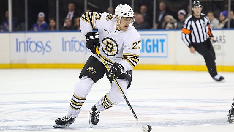 Nov 25, 2023; New York, New York, USA; Boston Bruins defenseman Hampus Lindholm (27) looks to pass against the New York Rangers during the third period at Madison Square Garden. Mandatory Credit: Danny Wild-USA TODAY Sports