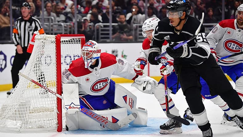 Nov 25, 2023; Los Angeles, California, USA; Montreal Canadiens goaltender Jake Allen (34) defends the goal against Los Angeles Kings center Quinton Byfield (55) during the second period at Crypto.com Arena. Mandatory Credit: Gary A. Vasquez-USA TODAY Sports