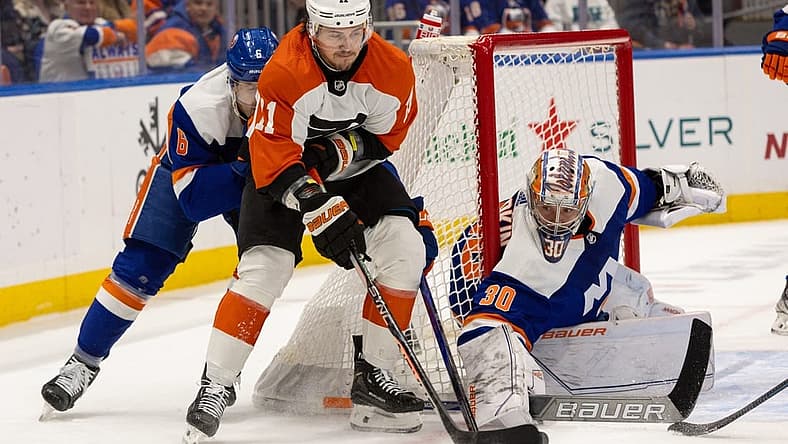 Nov 25, 2023; Elmont, New York, USA; Philadelphia Flyers right wing Travis Konecny (11) with the puck in front of New York Islanders goaltender Ilya Sorokin (30) during the first period at UBS Arena. Mandatory Credit: Thomas Salus-USA TODAY Sports