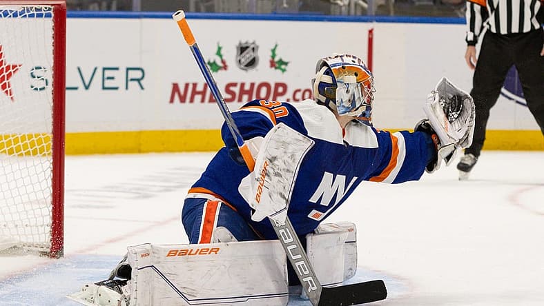 Nov 25, 2023; Elmont, New York, USA; New York Islanders goaltender Ilya Sorokin (30) makes a glove save against the Philadelphia Flyers during the overtime shootout at UBS Arena. Mandatory Credit: Thomas Salus-USA TODAY Sports