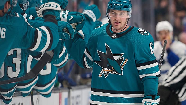 Nov 25, 2023; San Jose, California, USA; San Jose Sharks defenseman Ty Emberson (6) shakes hands with his teammates after scoring a goal against the Vancouver Canucks during the first period at SAP Center at San Jose. Mandatory Credit: Robert Edwards-USA TODAY Sports