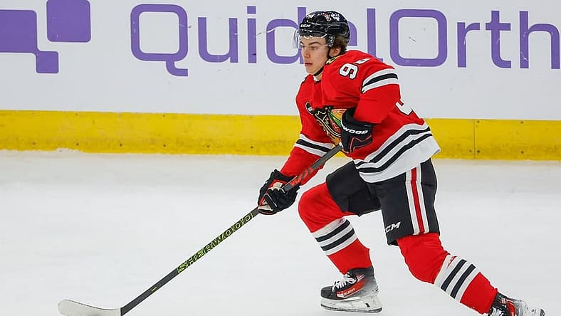 Nov 26, 2023; Chicago, Illinois, USA; Chicago Blackhawks center Connor Bedard (98) skates with the puck against the St. Louis Blues during the first period at United Center. Mandatory Credit: Kamil Krzaczynski-USA TODAY Sports