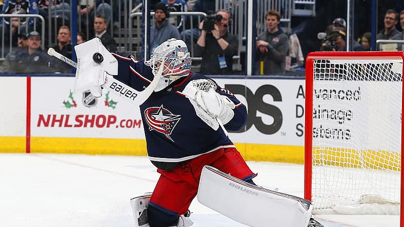 Nov 27, 2023; Columbus, Ohio, USA; Columbus Blue Jackets goalie Spencer Martin (30) makes a blocker save during the first period against the Boston Bruins at Nationwide Arena. Mandatory Credit: Russell LaBounty-USA TODAY Sports