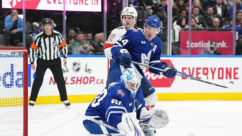 Nov 28, 2023; Toronto, Ontario, CAN; Florida Panthers left wing Matthew Tkachuk (19) battle in front of the net with Toronto Maple Leafs defenseman Morgan Rielly (44) during the second period at Scotiabank Arena. Mandatory Credit: Nick Turchiaro-USA TODAY Sports