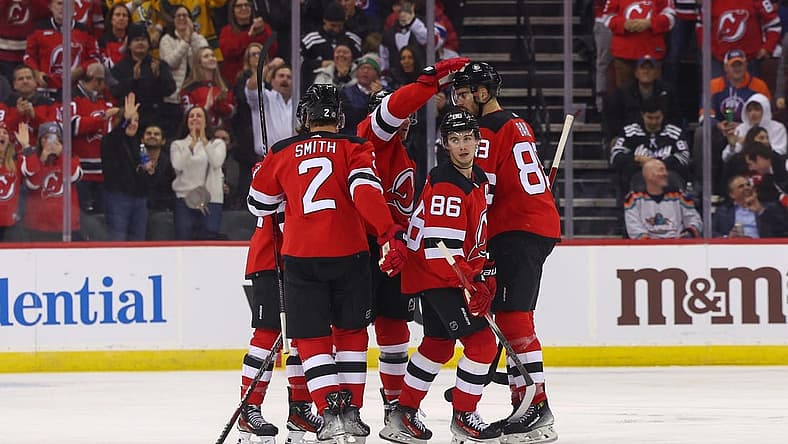Nov 28, 2023; Newark, New Jersey, USA; New Jersey Devils center Jack Hughes (86) celebrates his goal against the New York Islanders during the third period at Prudential Center. Mandatory Credit: Ed Mulholland-USA TODAY Sports