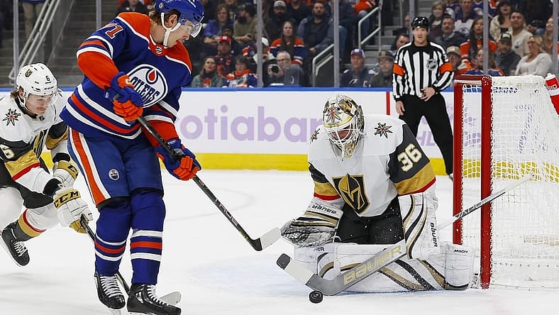 Nov 28, 2023; Edmonton, Alberta, CAN; Vegas Golden Knights goaltender Logan Thompson (36) makes a save on a shot by Edmonton Oilers forward Ryan McLeod (71) during the first period at Rogers Place. Mandatory Credit: Perry Nelson-USA TODAY Sports