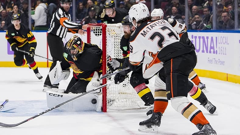 Nov 28, 2023; Vancouver, British Columbia, CAN; Vancouver Canucks goalie Thatcher Demko (35) makes a save on Anaheim Ducks forward Mason McTavish (23) in the third period at Rogers Arena. Vancouver won 3-1. Mandatory Credit: Bob Frid-USA TODAY Sports