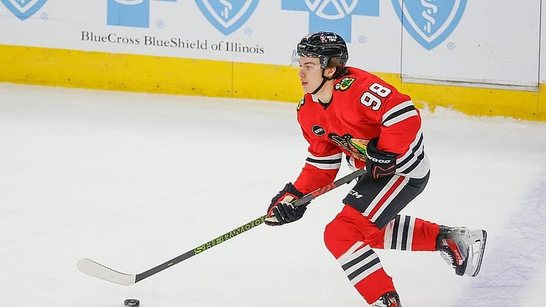 Nov 26, 2023; Chicago, Illinois, USA; Chicago Blackhawks center Connor Bedard (98) controls the puck against the St. Louis Blues during the first period at United Center. Mandatory Credit: Kamil Krzaczynski-USA TODAY Sports