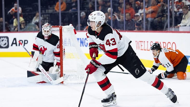 Nov 30, 2023; Philadelphia, Pennsylvania, USA; New Jersey Devils defenseman Luke Hughes (43) skates with the puck against the Philadelphia Flyers during the first period at Wells Fargo Center. Mandatory Credit: Bill Streicher-USA TODAY Sports