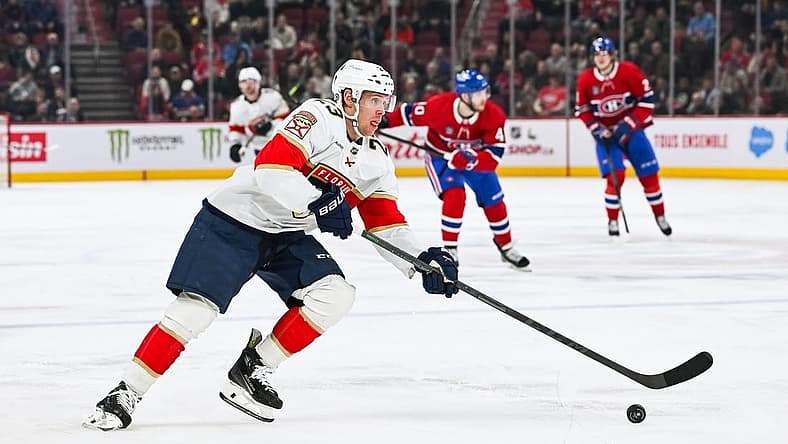 Nov 30, 2023; Montreal, Quebec, CAN; Florida Panthers center Carter Verhaeghe (23) plays the puck against the Montreal Canadiens during the second period at Bell Centre. Mandatory Credit: David Kirouac-USA TODAY Sports