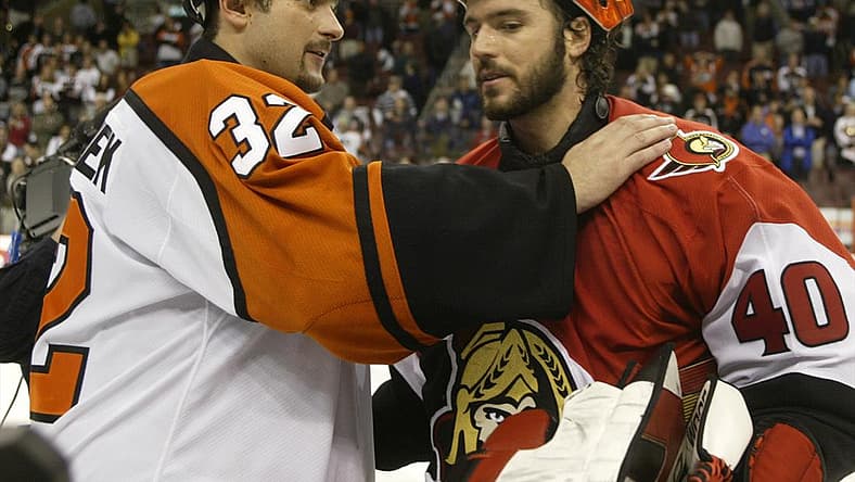 Ottawa Senators goalie Patrick Lalime (R) is congratulated by Philadelphia Flyers goalie Roman Cechmanek after the Senators won the NHL Eastern conference semi-finals at First Union Center in Philadelphia, May 5, 2003. Ottawa defeated Philadelphia 5-1, and won the series four games to two.