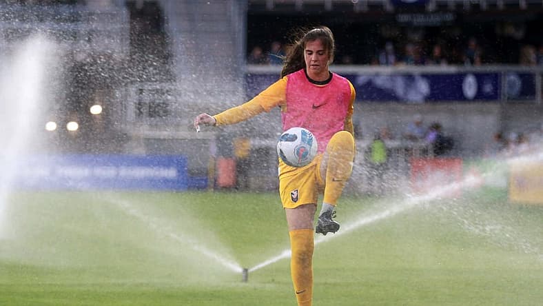 Jun 11, 2022; Louisville, Kentucky, USA; Angel City FC goalkeeper Maia Perez (24) warms up during half time as the sprinkler system runs against Racing Louisville FC at Lynn Family Stadium. Mandatory Credit: EM Dash-USA TODAY Sports