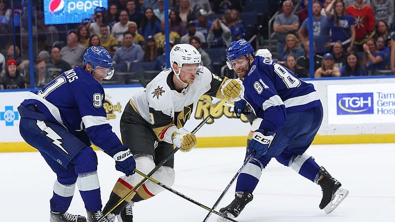 Mar 9, 2023; Tampa, Florida, USA; Tampa Bay Lightning center Steven Stamkos (91) and defenseman Erik Cernak (81) defend Vegas Golden Knights center Jack Eichel (9)  during overtime at Amalie Arena. Mandatory Credit: Kim Klement-USA TODAY Sports