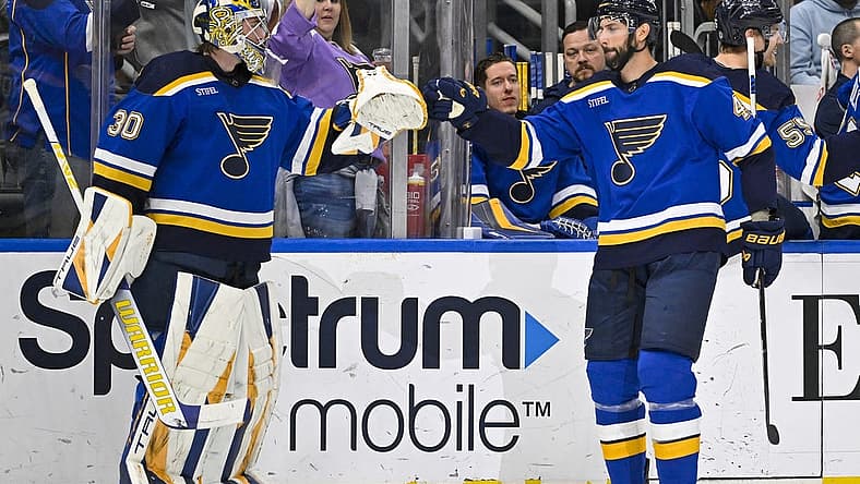 Mar 21, 2023; St. Louis, Missouri, USA;  St. Louis Blues defenseman Robert Bortuzzo (41) is congratulated by goaltender Joel Hofer (30) after scoring against the Detroit Red Wings during the first period at Enterprise Center. Mandatory Credit: Jeff Curry-USA TODAY Sports