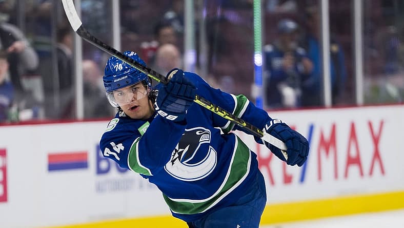 Apr 2, 2023; Vancouver, British Columbia, CAN; Vancouver Canucks defenseman Ethan Bear (74) shoots during warm up prior to a game against the Los Angeles Kings at Rogers Arena. Mandatory Credit: Bob Frid-USA TODAY Sports
