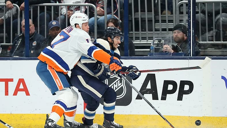 Oct 28, 2023; Columbus, Ohio, USA; New York Islanders left wing Matt Martin (17) fights for the puck with Columbus Blue Jackets left wing Johnny Gaudreau (13)during the first period at Nationwide Arena. Mandatory Credit: Joseph Maiorana-USA TODAY Sports