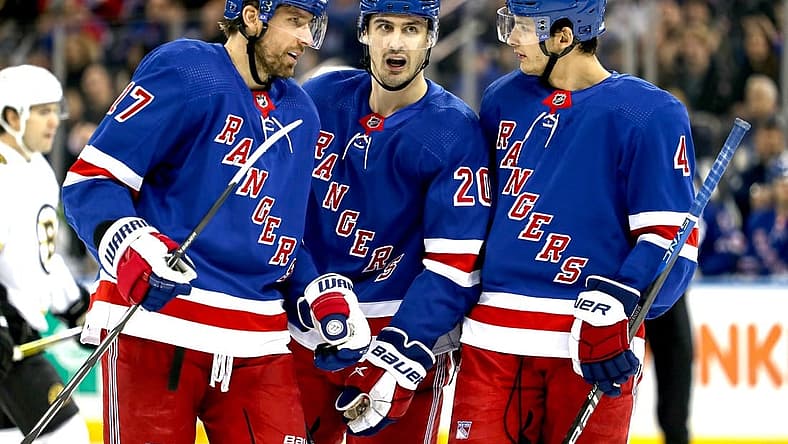 Nov 25, 2023; New York, New York, USA; New York Rangers left wing Chris Kreider (20) talks with right wing Blake Wheeler (17) and defenseman Braden Schneider (4) during the first period against the Boston Bruins at Madison Square Garden. Mandatory Credit: Danny Wild-USA TODAY Sports