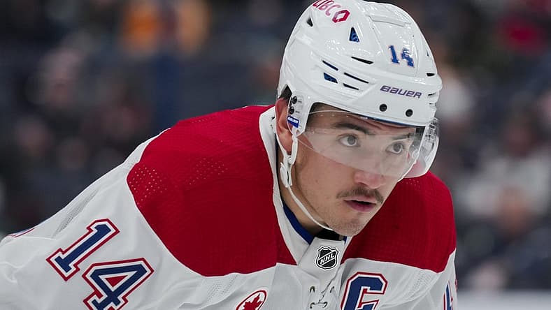 Nov 29, 2023; Columbus, Ohio, USA; Montreal Canadiens center Nick Suzuki (14) awaits the face-off against the Columbus Blue Jackets in the first period at Nationwide Arena. Mandatory Credit: Aaron Doster-USA TODAY Sports