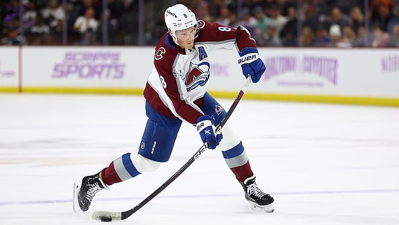 Nov 30, 2023; Tempe, Arizona, USA; Colorado Avalanche defenseman Cale Makar (8) shoots the puck against the Arizona Coyotes in the first period at Mullett Arena. Mandatory Credit: Mark J. Rebilas-USA TODAY Sports
