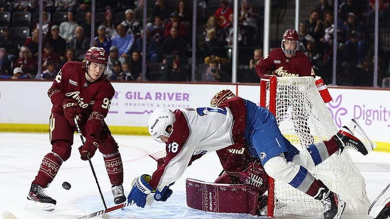 Nov 30, 2023; Tempe, Arizona, USA; Colorado Avalanche left wing Miles Wood (28) is upended as he attempts to score a goal against the Arizona Coyotes in the first period at Mullett Arena. Mandatory Credit: Mark J. Rebilas-USA TODAY Sports