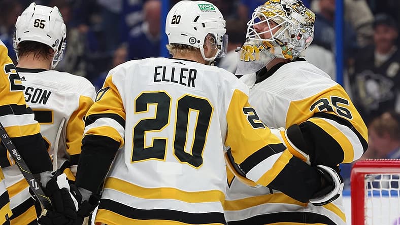 Nov 30, 2023; Tampa, Florida, USA; Pittsburgh Penguins goaltender Tristan Jarry (35) is congratulated after he scored a goal against the Tampa Bay Lightning during the third period at Amalie Arena. Mandatory Credit: Kim Klement Neitzel-USA TODAY Sports