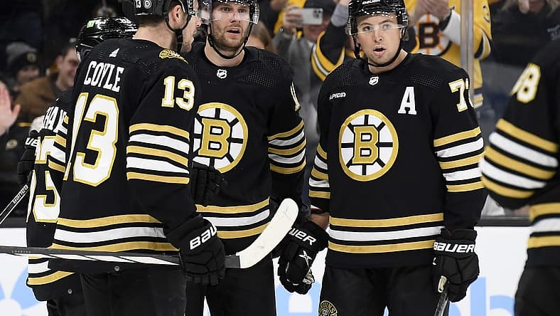 Nov 30, 2023; Boston, Massachusetts, USA; Boston Bruins center Pavel Zacha (18) celebrates his goal with center Charlie Coyle (13) and defenseman Charlie McAvoy (73) during the third period against the San Jose Sharks at TD Garden. Mandatory Credit: Bob DeChiara-USA TODAY Sports