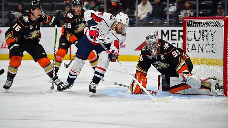 Nov 30, 2023; Anaheim, California, USA; Washington Capitals right wing Anthony Mantha (39) moves in to score a goal against Anaheim Ducks goaltender John Gibson (36) during the first period at Honda Center. Mandatory Credit: Gary A. Vasquez-USA TODAY Sports