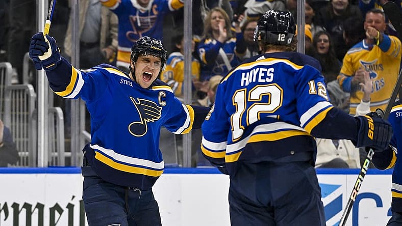 Nov 30, 2023; St. Louis, Missouri, USA; St. Louis Blues right wing Kevin Hayes (12) is congratulated by center Brayden Schenn (10) after scoring against the Buffalo Sabres during the second period at Enterprise Center. Mandatory Credit: Jeff Curry-USA TODAY Sports