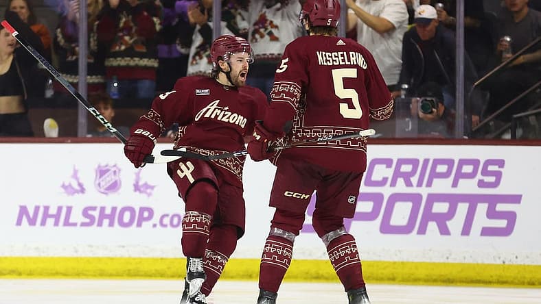 Nov 30, 2023; Tempe, Arizona, USA; Arizona Coyotes left wing Michael Carcone (53) celebrates with defenseman Michael Kesselring (5) after scoring a goal against the Colorado Avalanche in the third period at Mullett Arena. Mandatory Credit: Mark J. Rebilas-USA TODAY Sports