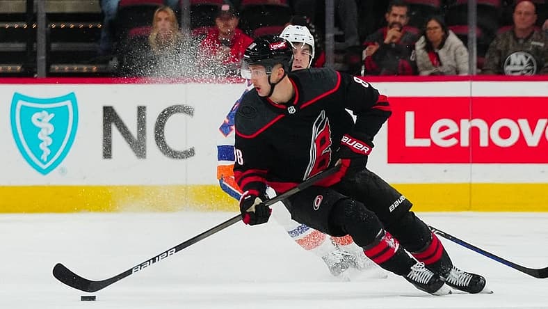 Nov 30, 2023; Raleigh, North Carolina, USA; Carolina Hurricanes center Martin Necas (88) skates against the New York Islanders during the overtime at PNC Arena. Mandatory Credit: James Guillory-USA TODAY Sports