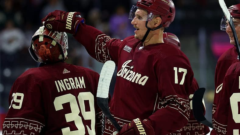 Nov 30, 2023; Tempe, Arizona, USA; Arizona Coyotes center Nick Bjugstad (17) celebrates with goalie Connor Ingram (39) after scoring the winning goal against the Colorado Avalanche in overtime at Mullett Arena. Mandatory Credit: Mark J. Rebilas-USA TODAY Sports