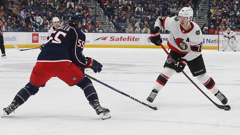 Dec 1, 2023; Columbus, Ohio, USA; Ottawa Senators defenseman Thomas Chabot (72) takes a shot as Columbus Blue Jackets defenseman David Jiricek (55) defends during the third period at Nationwide Arena. Mandatory Credit: Russell LaBounty-USA TODAY Sports