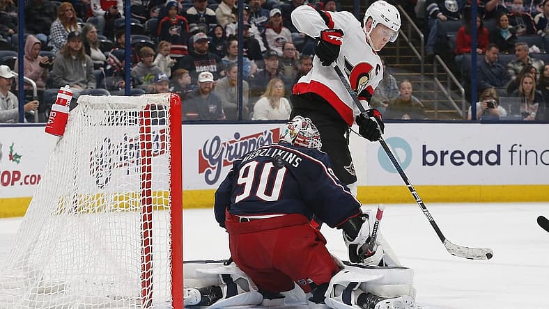 Dec 1, 2023; Columbus, Ohio, USA; Ottawa Senators left wing Brady Tkachuk (7) tips the puck wide of Columbus Blue Jackets goalie Elvis Merzlikins (90) during the third period at Nationwide Arena. Mandatory Credit: Russell LaBounty-USA TODAY Sports