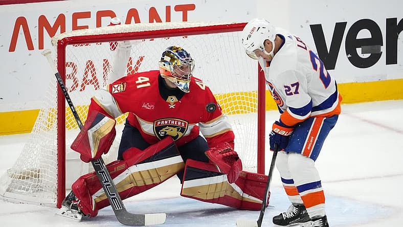Dec 2, 2023; Sunrise, Florida, USA; Florida Panthers goaltender Anthony Stolarz (41) blocks the shot of New York Islanders left wing Anders Lee (27) during the second period at Amerant Bank Arena. Mandatory Credit: Jasen Vinlove-USA TODAY Sports