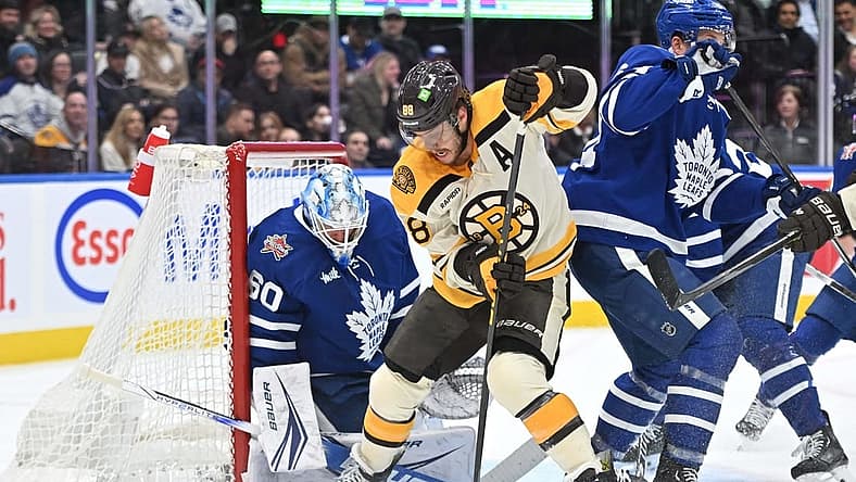 Dec 2, 2023; Toronto, Ontario, CAN; Toronto Maple Leafs goalie Joseph Woll (60) makes a save on a shot from Boston Bruins forward David Pastrnak (88) in the second period at Scotiabank Arena. Mandatory Credit: Dan Hamilton-USA TODAY Sports