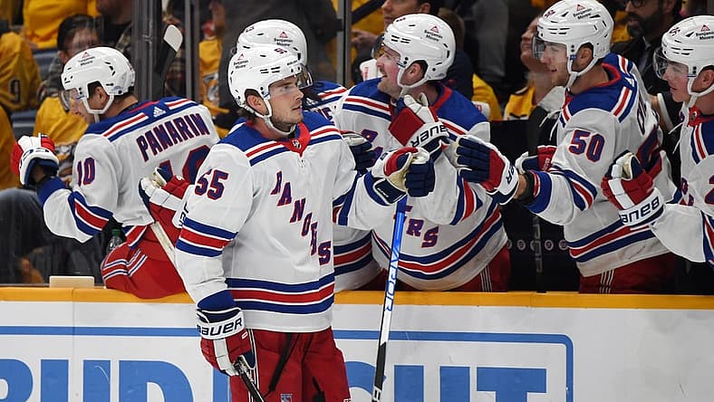 Dec 2, 2023; Nashville, Tennessee, USA; New York Rangers defenseman Ryan Lindgren (55) is congratulated by teammates after a goal during the third period against the Nashville Predators at Bridgestone Arena. Mandatory Credit: Christopher Hanewinckel-USA TODAY Sports