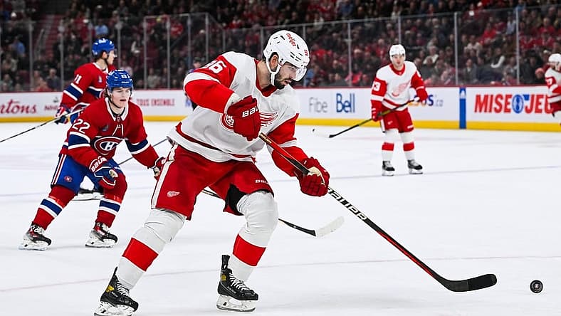 Dec 2, 2023; Montreal, Quebec, CAN; Detroit Red Wings defenseman Jake Walman (96) plays the puck against the Montreal Canadiens during the third period at Bell Centre. Mandatory Credit: David Kirouac-USA TODAY Sports