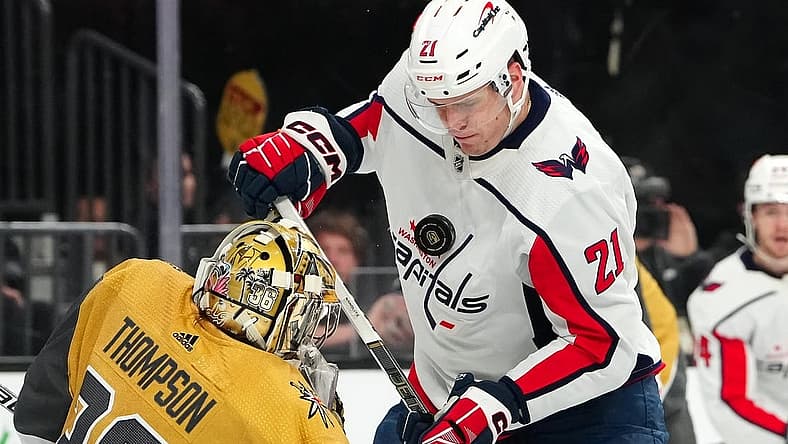 Dec 2, 2023; Las Vegas, Nevada, USA; Vegas Golden Knights goaltender Logan Thompson (36) deflects the puck into the chest of Washington Capitals center Aliaksei Protas (21) during the first period at T-Mobile Arena. Mandatory Credit: Stephen R. Sylvanie-USA TODAY Sports
