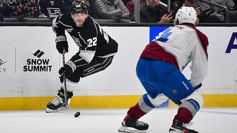 Dec 3, 2023; Los Angeles, California, USA; Los Angeles Kings left wing Kevin Fiala (22) moves the puck against Colorado Avalanche defenseman Bowen Byram (4) during the second period at Crypto.com Arena. Mandatory Credit: Gary A. Vasquez-USA TODAY Sports