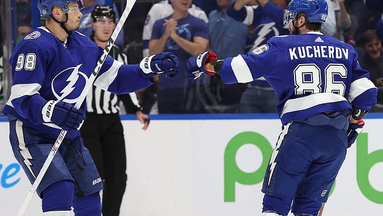 Dec 4, 2023; Tampa, Florida, USA; Tampa Bay Lightning right wing Nikita Kucherov (86) celebrates with defenseman Mikhail Sergachev (98) after he scores a goal against the Dallas Stars during the first period at Amalie Arena. Mandatory Credit: Kim Klement Neitzel-USA TODAY Sports