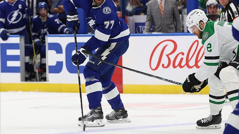 Dec 4, 2023; Tampa, Florida, USA;Tampa Bay Lightning defenseman Victor Hedman (77) passes the puck against the Dallas Stars during the first period at Amalie Arena. Mandatory Credit: Kim Klement Neitzel-USA TODAY Sports