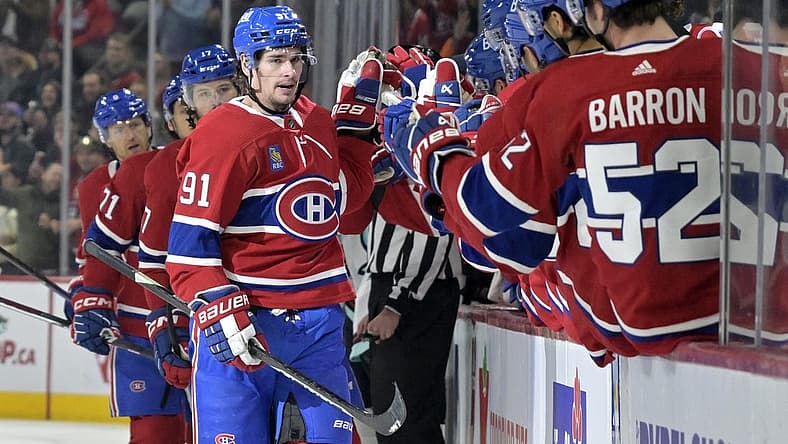 Dec 4, 2023; Montreal, Quebec, CAN; Montreal Canadiens forward Sean Monahan (91) celebrates with teammates after scoring a goal against the Seattle Kraken during the first period at the Bell Centre. Mandatory Credit: Eric Bolte-USA TODAY Sports