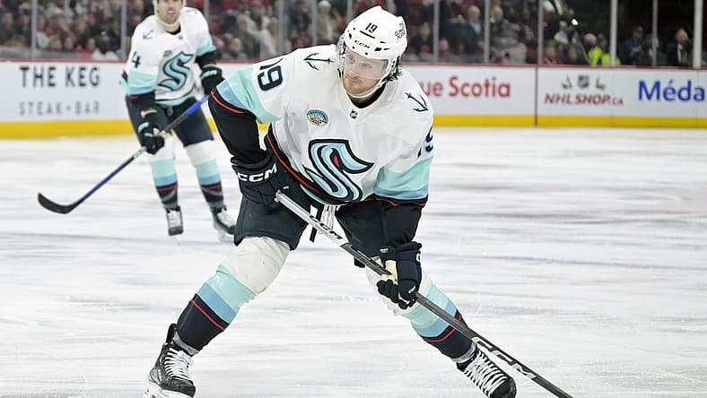 Dec 4, 2023; Montreal, Quebec, CAN; Seattle Kraken forward Jared McCann (19) takes a shot on net during the third period of the game against the Montreal Canadiens at the Bell Centre. Mandatory Credit: Eric Bolte-USA TODAY Sports